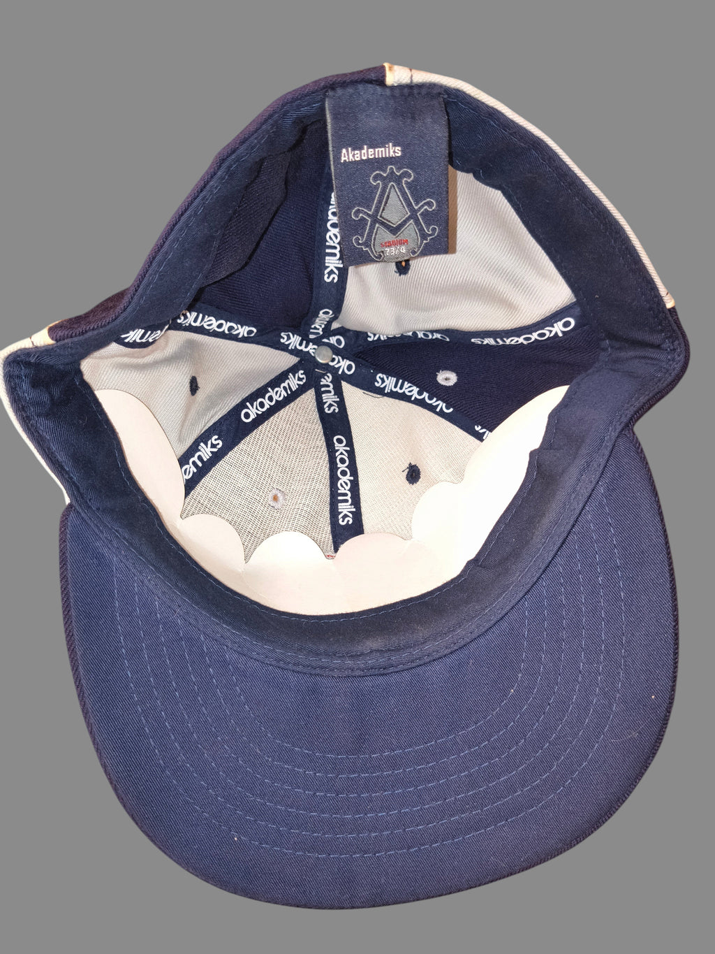 Awsum Thrift vintage Akademiks Stadium fitted hat interior showing branded taping and navy and grey panels