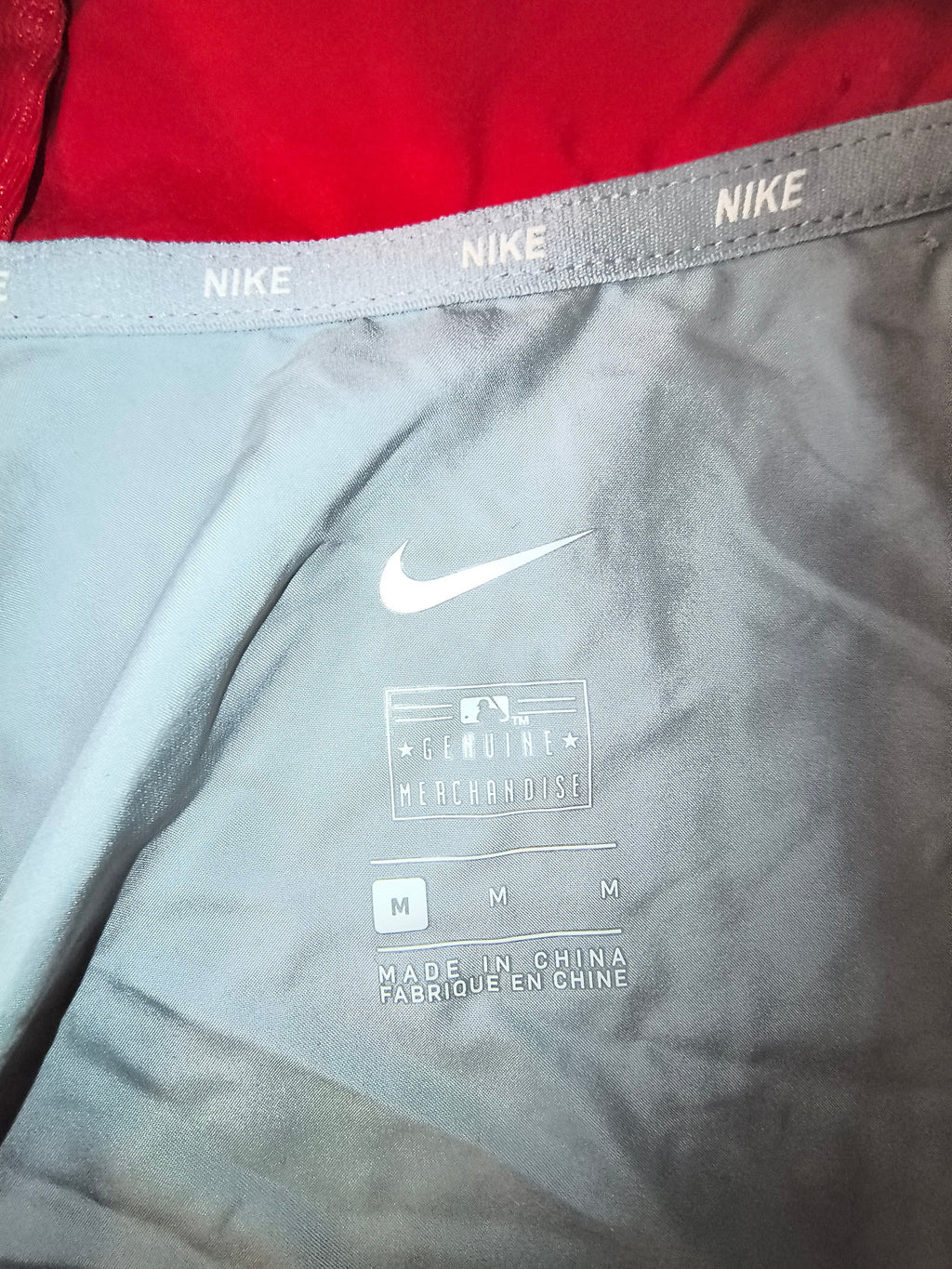 Awsum Thrift Nike Philadelphia Phillies track jacket interior label with size medium and MLB branding