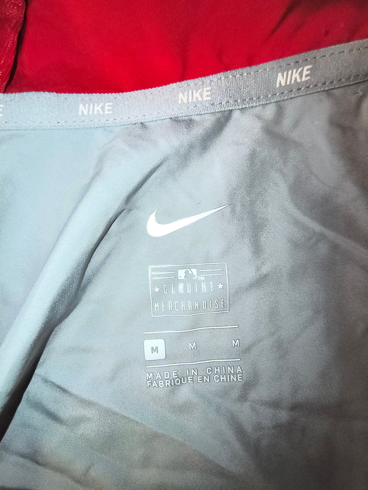 Awsum Thrift Nike Philadelphia Phillies track jacket interior label with size medium and MLB branding