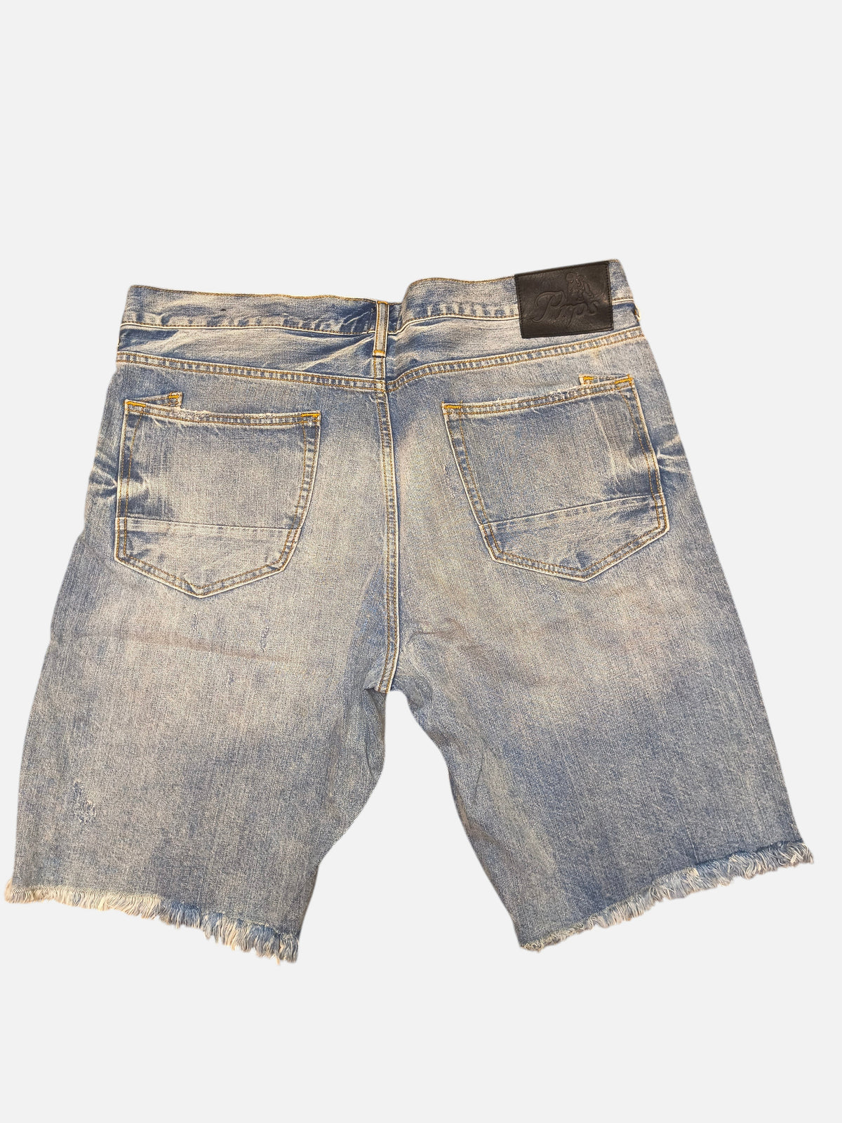 Awsum Thrift PRPS blue denim shorts with a frayed hem and black leather brand patch on the back waist.