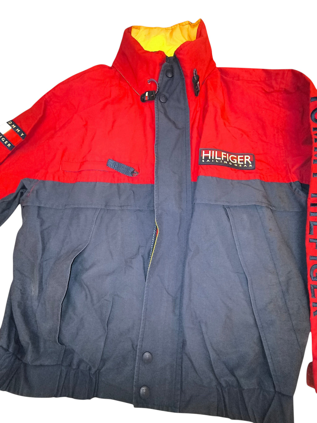 Awsum Thrift vintage Tommy Hilfiger sailing gear jacket in red and navy with a yellow hideaway hood