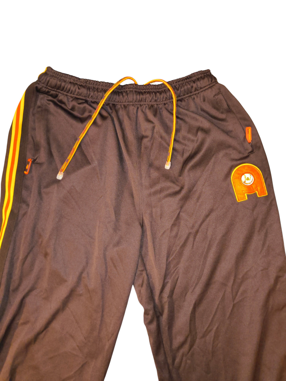 Awsum Thrift vintage Akademiks chocolate brown track pants with orange and yellow side stripes and logo patch