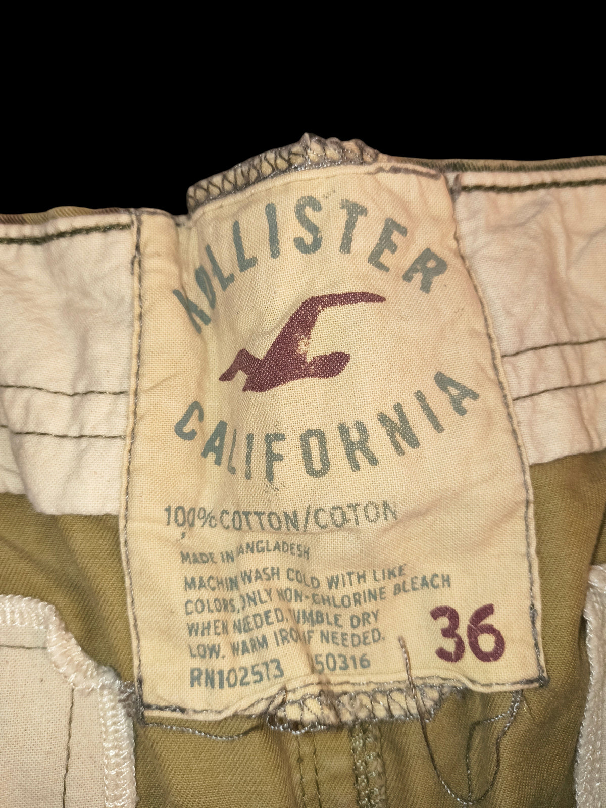 Awsum Thrift Hollister California cargo shorts interior size label, 100% cotton, size 36, with seagull logo