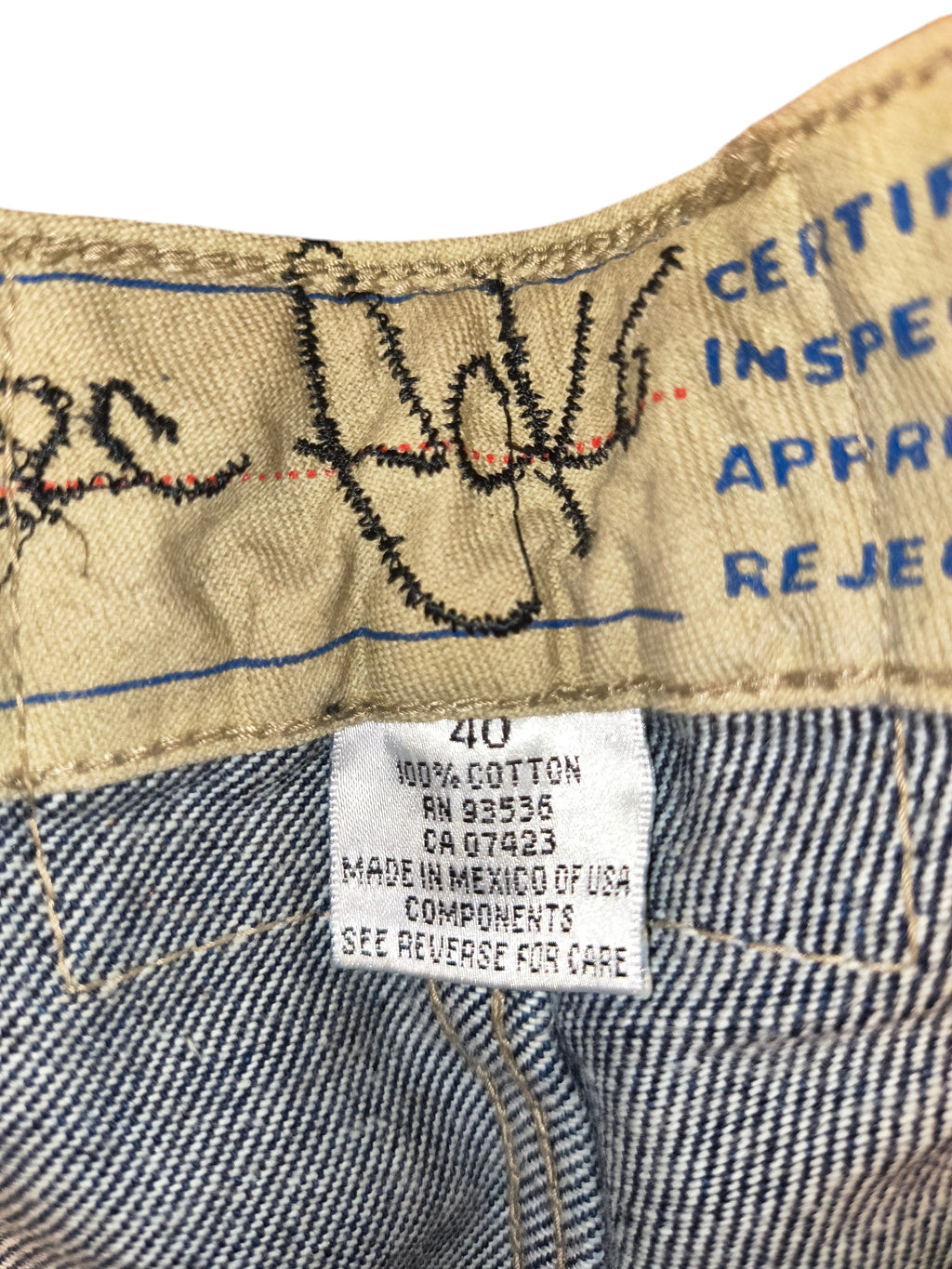 Awsum Thrift Ecko shorts size 40 label showing 100 percent cotton material and manufacturing details