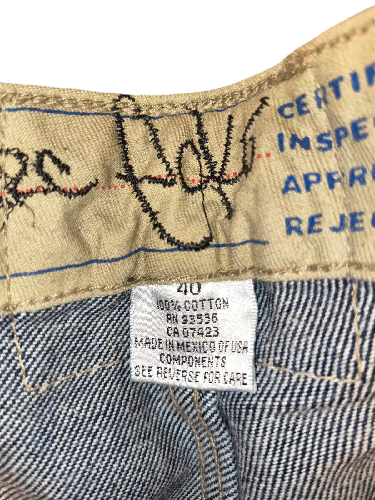 Awsum Thrift Ecko shorts size 40 label showing 100 percent cotton material and manufacturing details