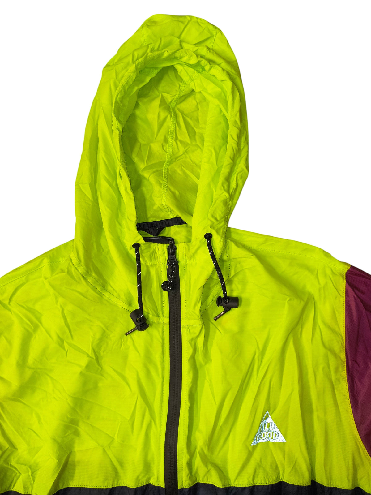 Awsum Thrift All Good lightweight colorblock windbreaker with neon yellow hood, full-zip front, and reflective logo.