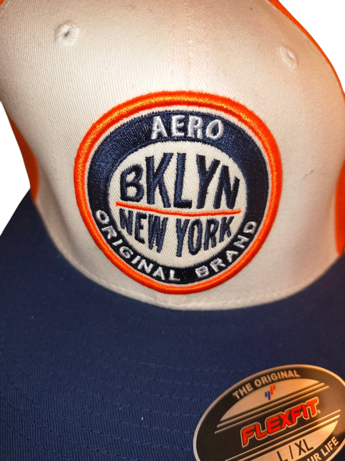 Awsum Thrift Aéropostale Aero BKLYN New York flat-brim cap with orange, navy, and white color-blocked design.