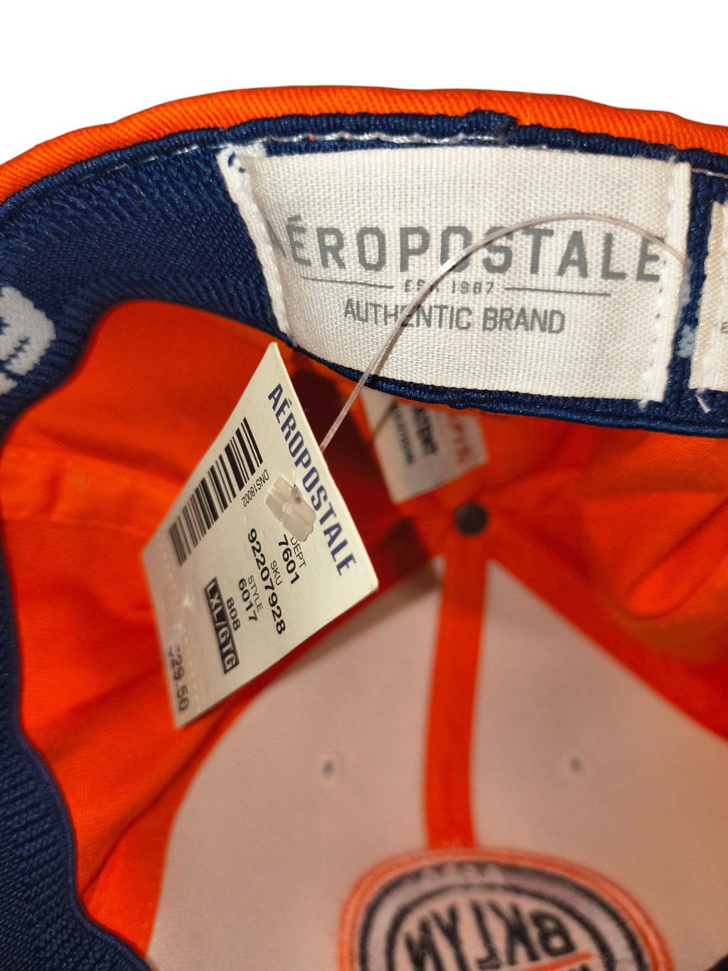 Awsum Thrift Aéropostale hat interior showing brand tag and retail hangtag with size L/XL label