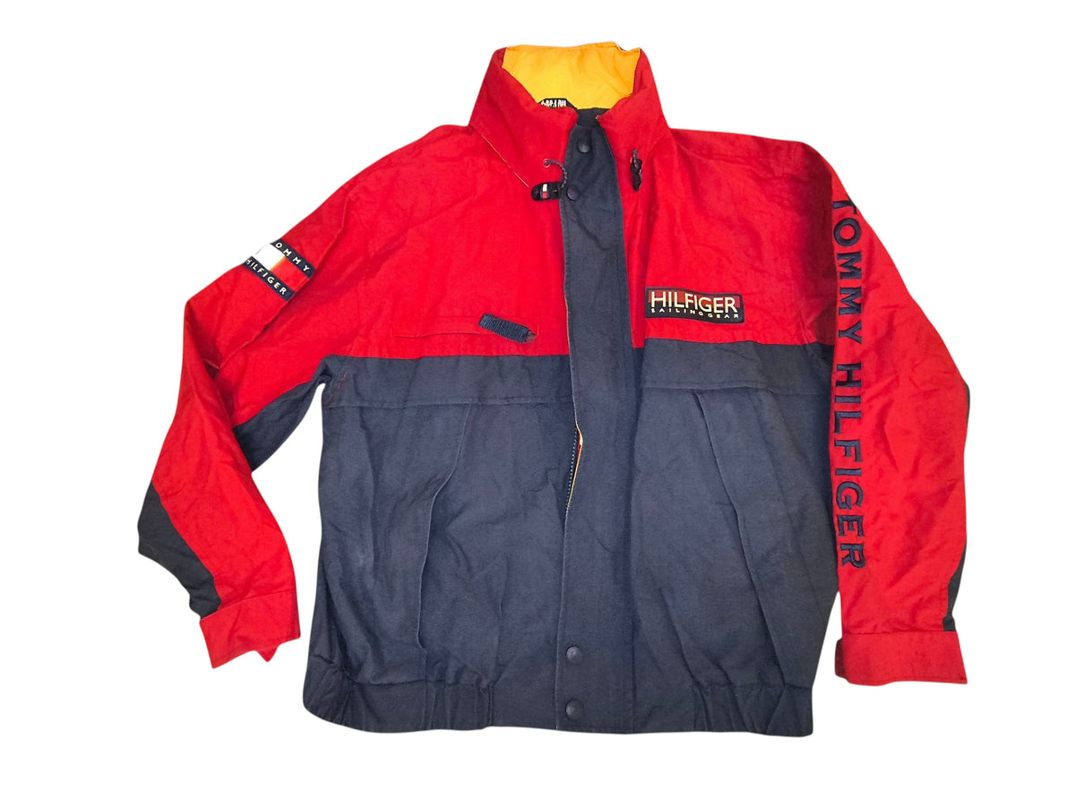Awsum Thrift vintage Tommy Hilfiger colorblock sailing jacket in red and navy with a hideaway hood and logo branding