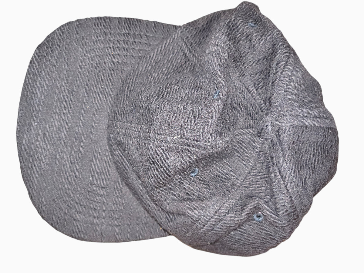 Awsum Thrift Publish Brand Davin black textured 5-panel camper hat with a flat brim and adjustable strapback closure.