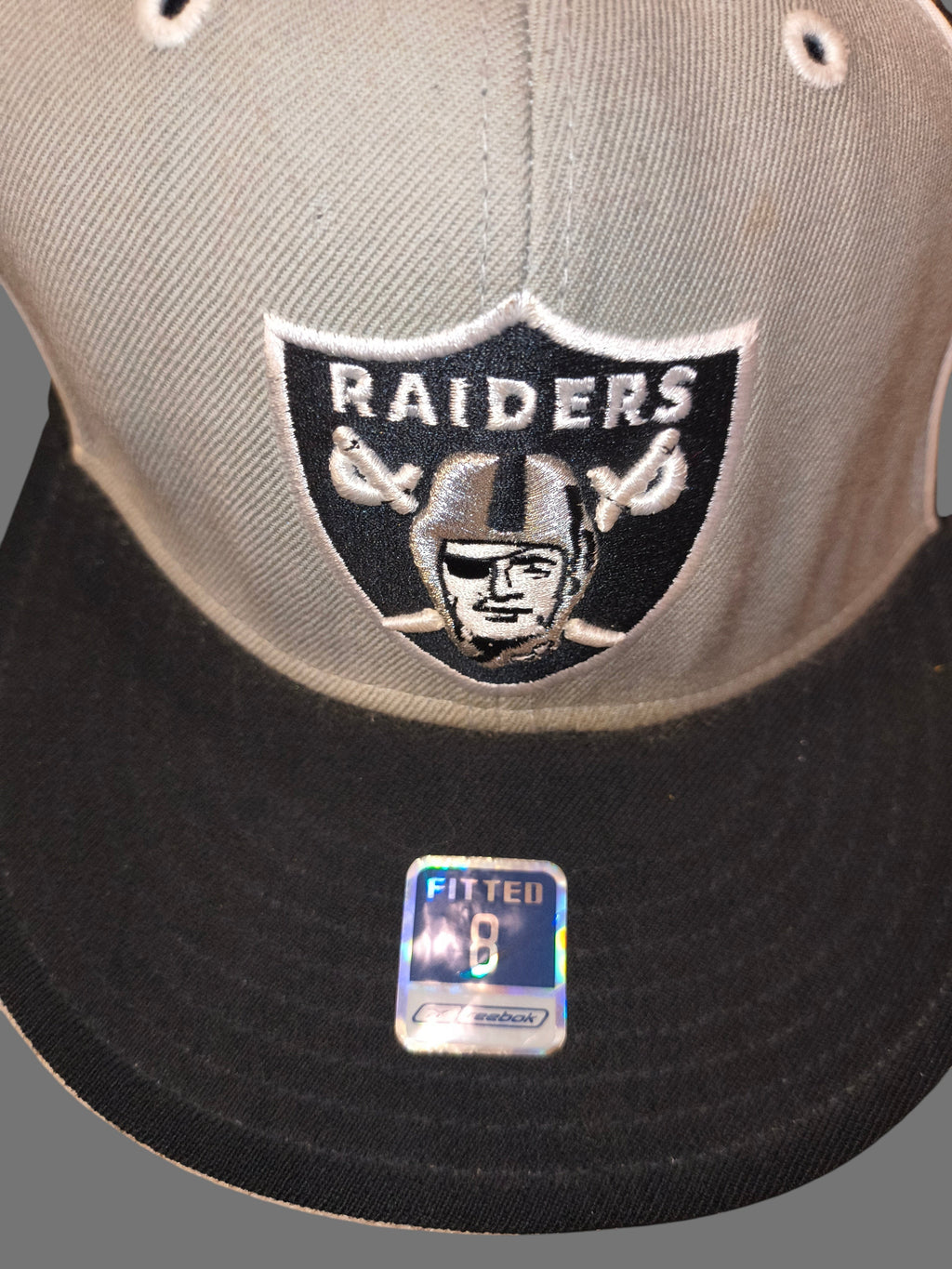 Awsum Thrift vintage Reebok Raiders wool fitted hat with embroidered team logo and holographic size 8 visor sticker