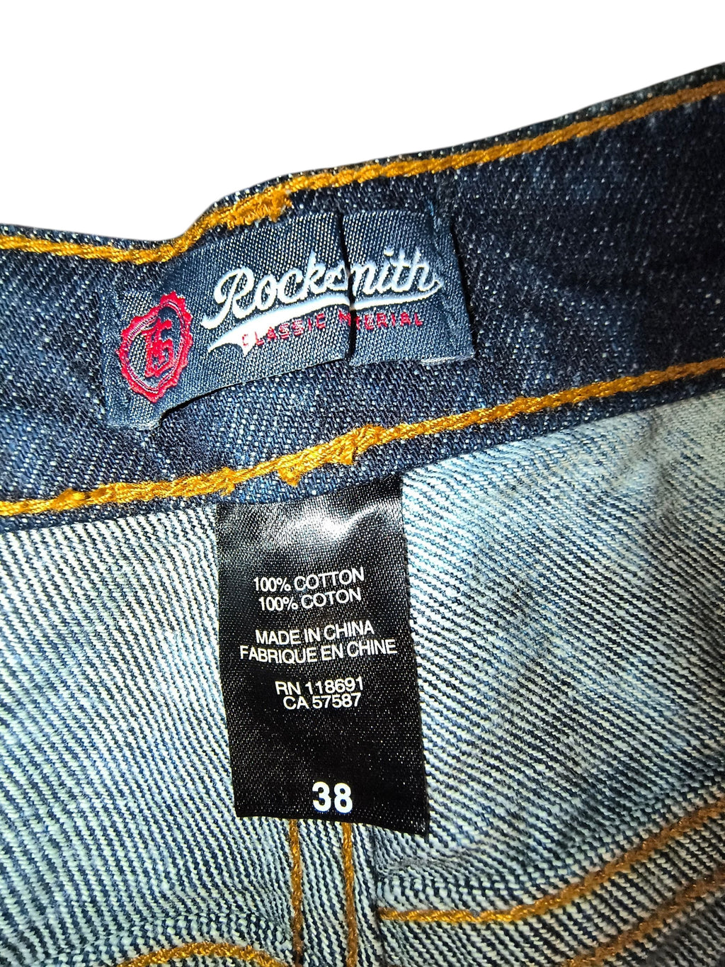 Awsum Thrift Rocksmith NYC jeans interior label showing 100 percent cotton material and size 38 waist tag