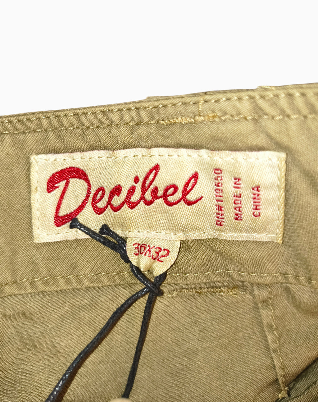 Awsum Thrift Decibel brand clothing label on khaki cotton canvas tactical cargo pants with 36x32 size tag attached