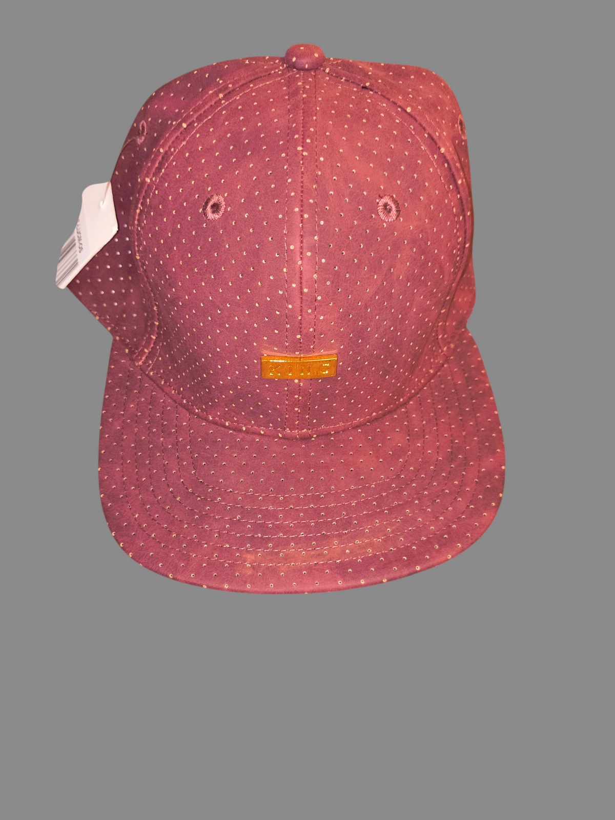 Awsum Thrift King Apparel maroon perforated faux-leather snapback hat with a polished gold metal logo plate.
