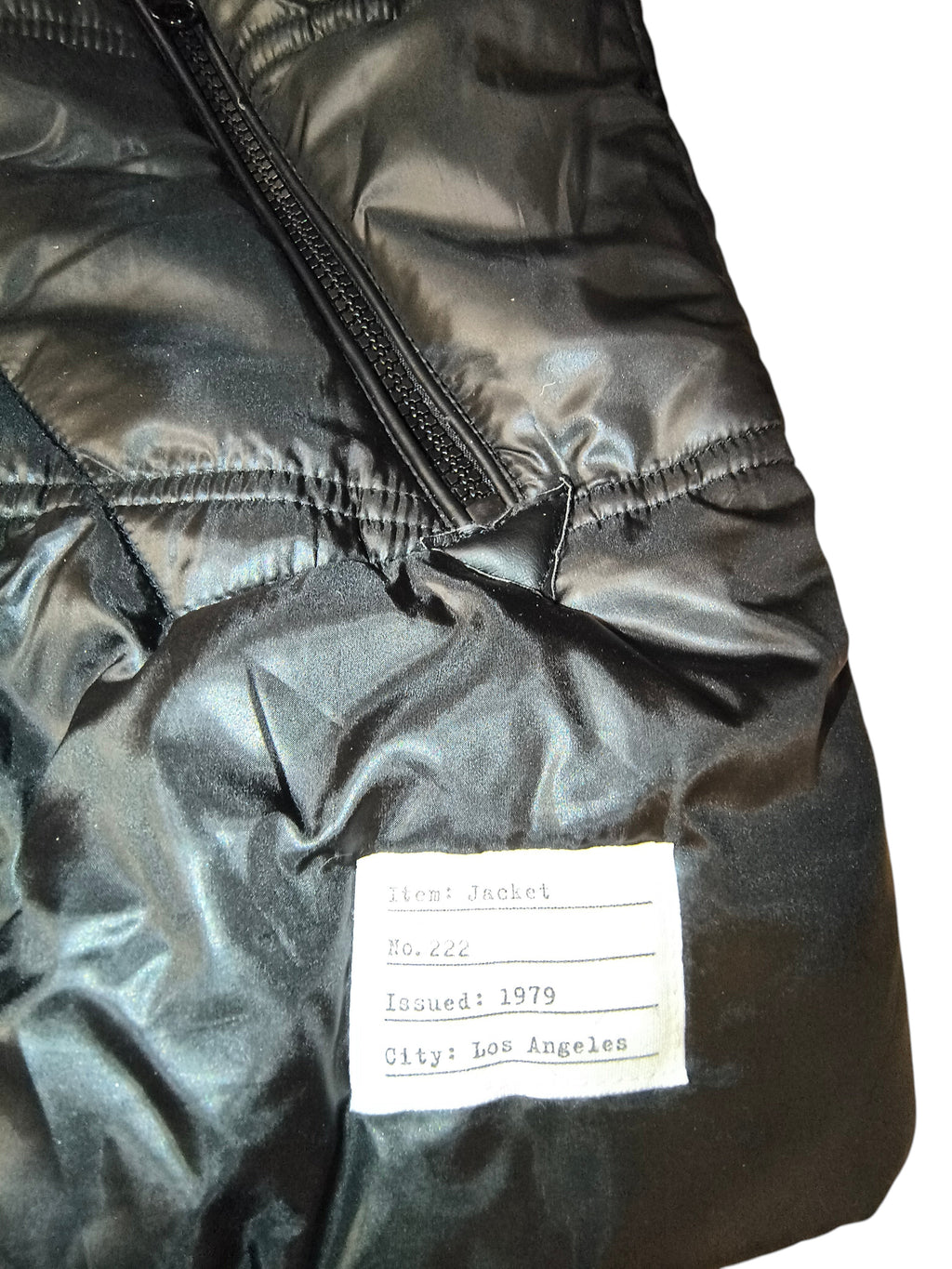 Awsum Thrift Adam Levine black quilted nylon jacket featuring a vintage-style Issued 1979 Los Angeles hem tag