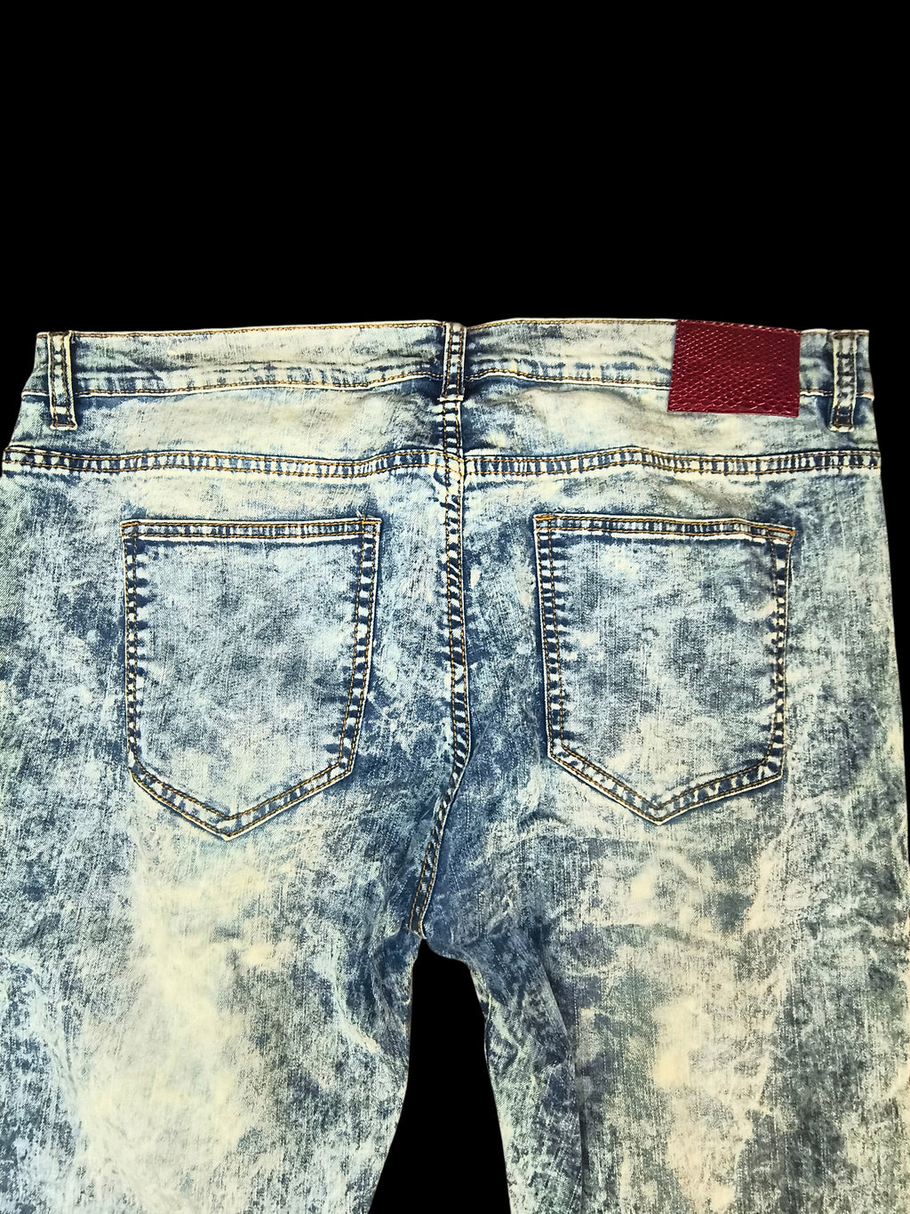 Awsum Thrift Scout Denim light ice-blue acid wash jeans with a red snakeskin-embossed back patch, back view.