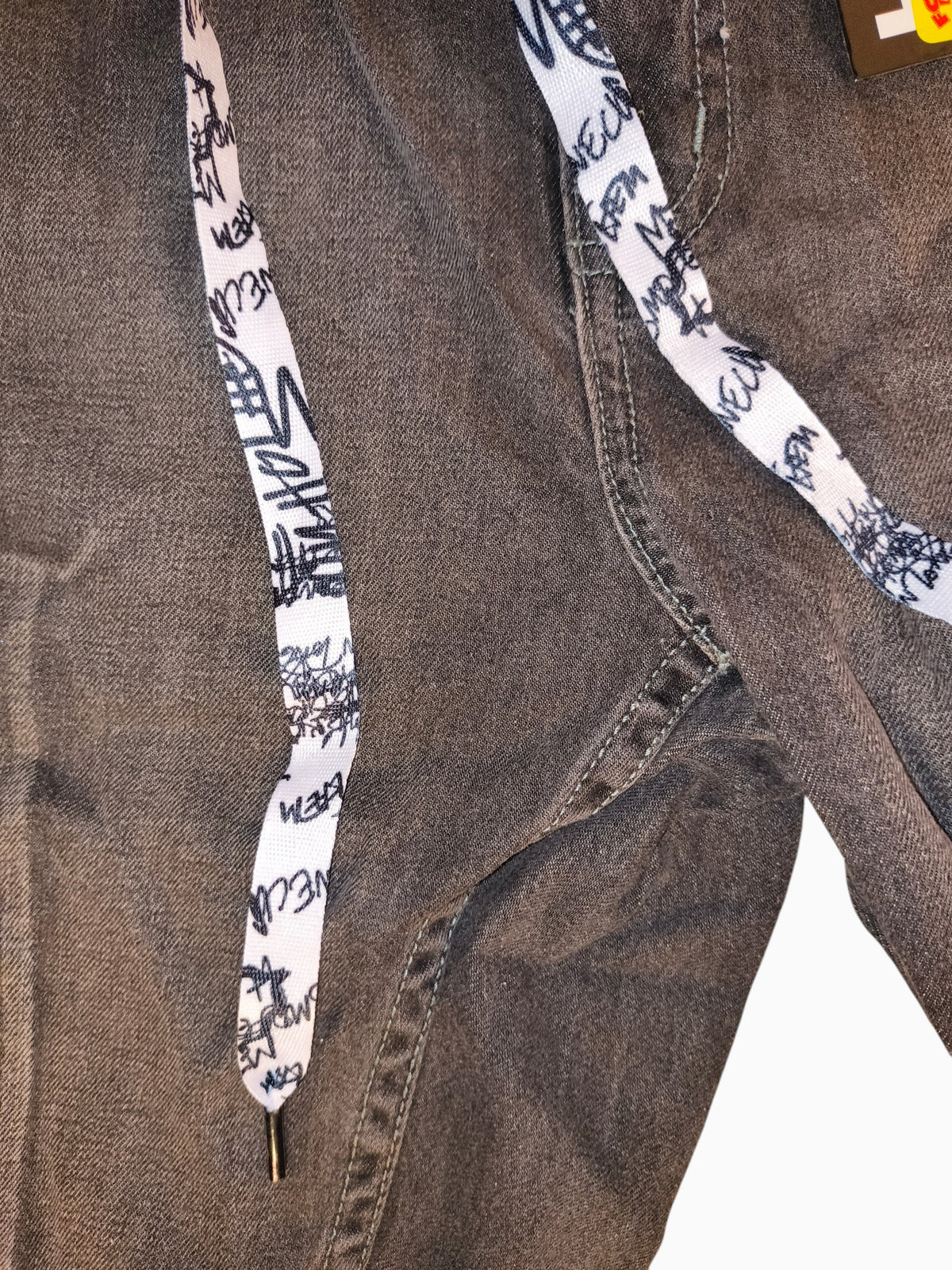 Awsum Thrift Trukfit grey distressed denim shorts with white graphic print drawstrings and charcoal wash