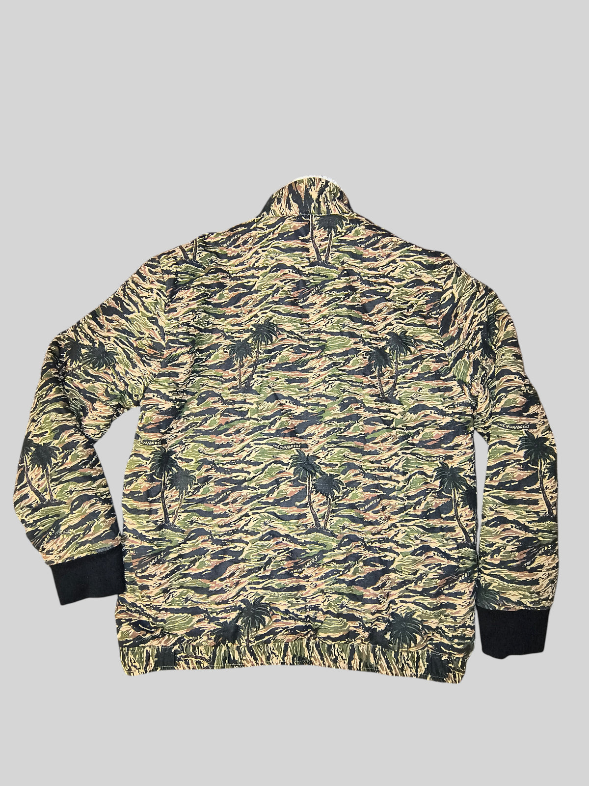 Awsum Thrift The Hundreds tiger palms camo bomber jacket with black ribbed cuffs and hem, back view.