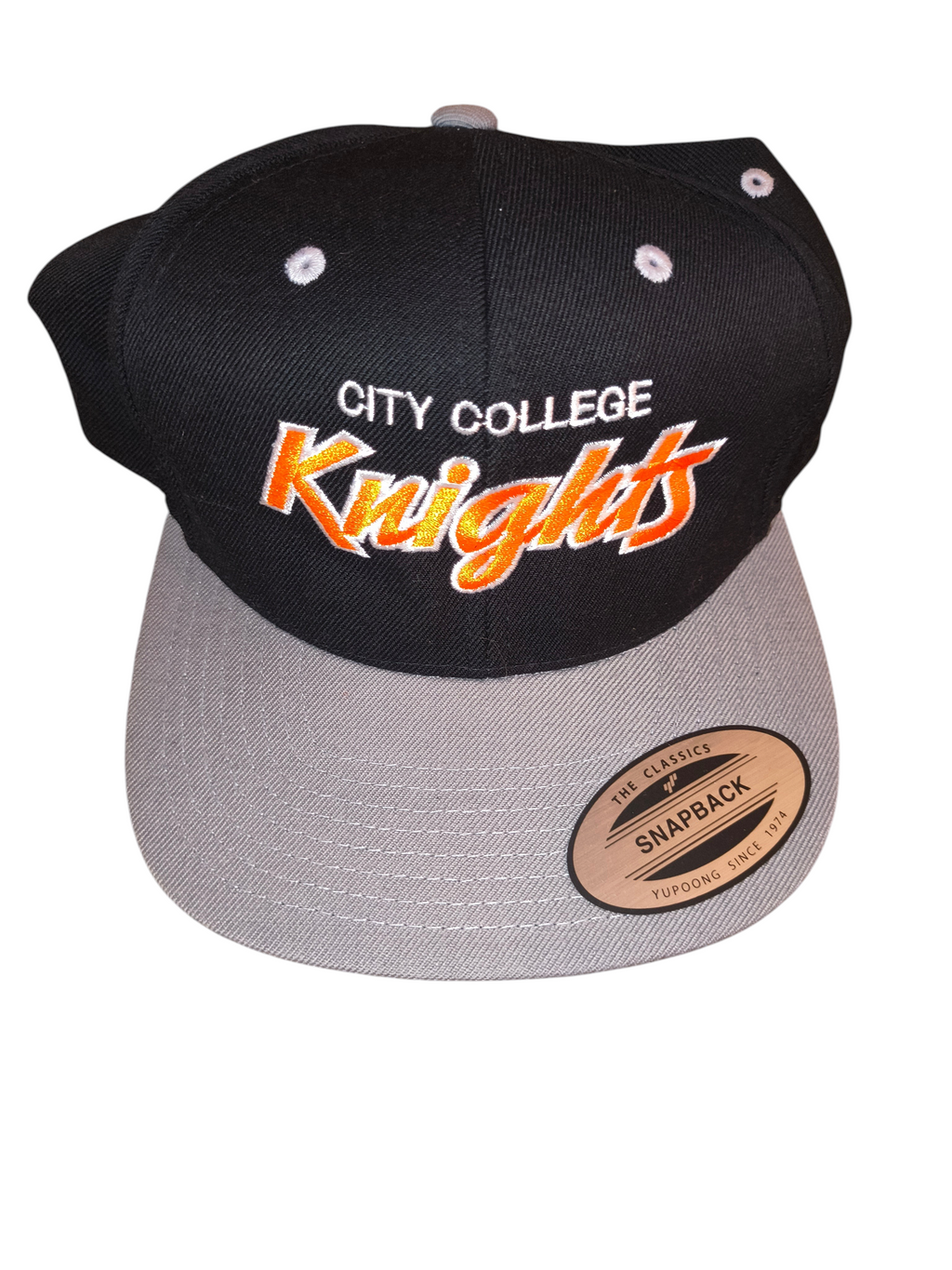 Awsum Thrift City College Knights snapback hat with black crown, grey brim, and orange collegiate script embroidery.
