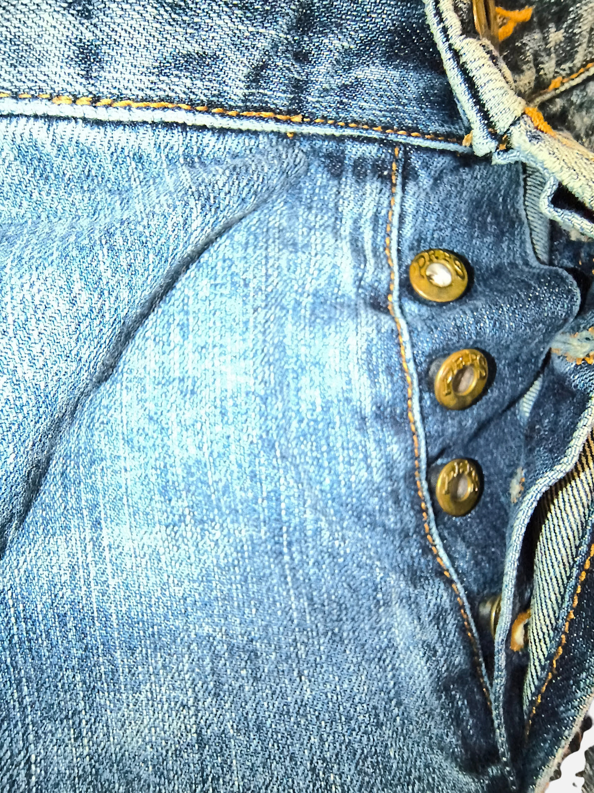 Awsum Thrift PRPS denim shorts featuring a classic button fly closure with branded metal buttons and contrast stitching