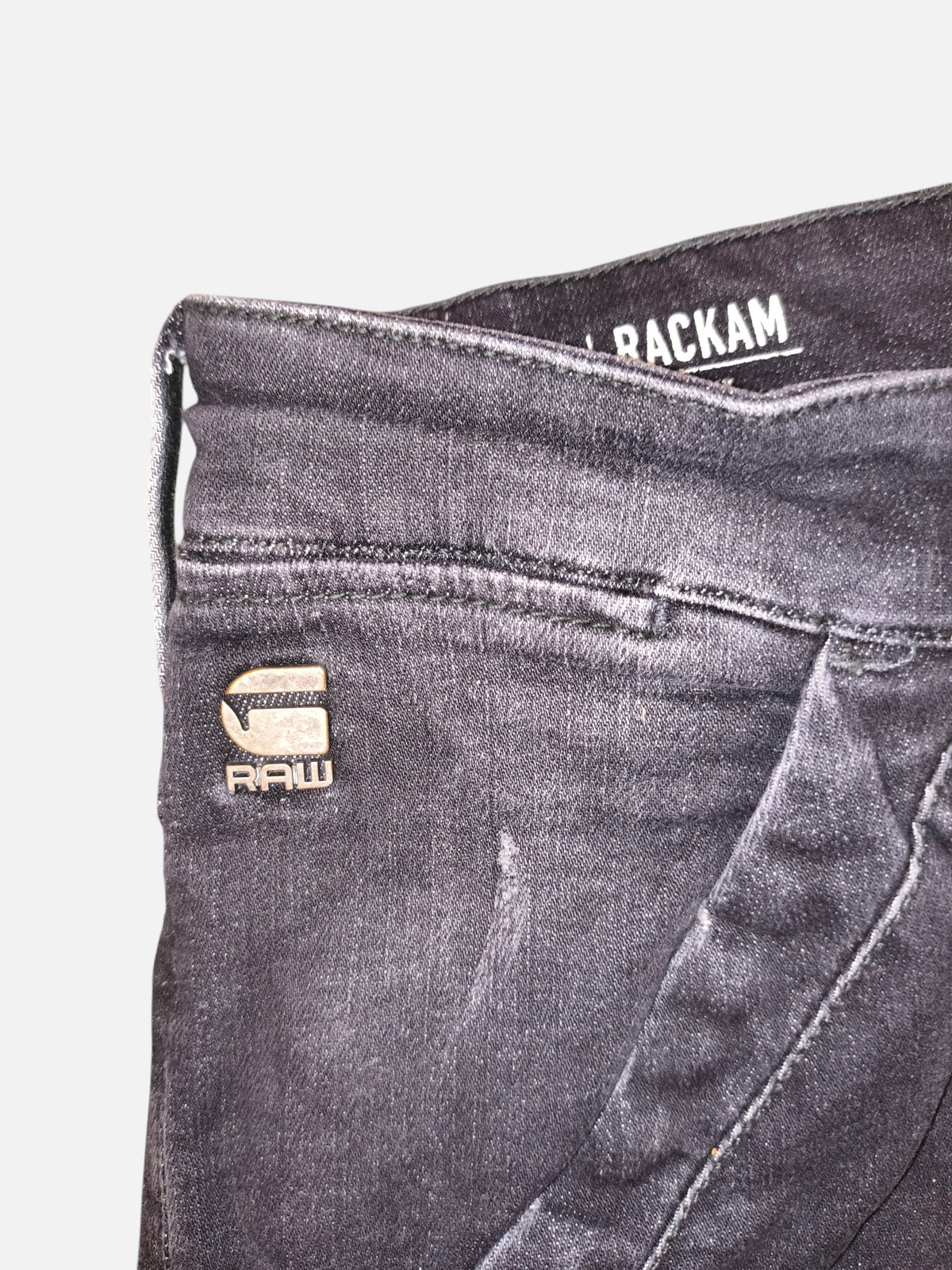 Awsum Thrift G-Raw RackHam black denim jeans with branded metal logo detail on the front pocket