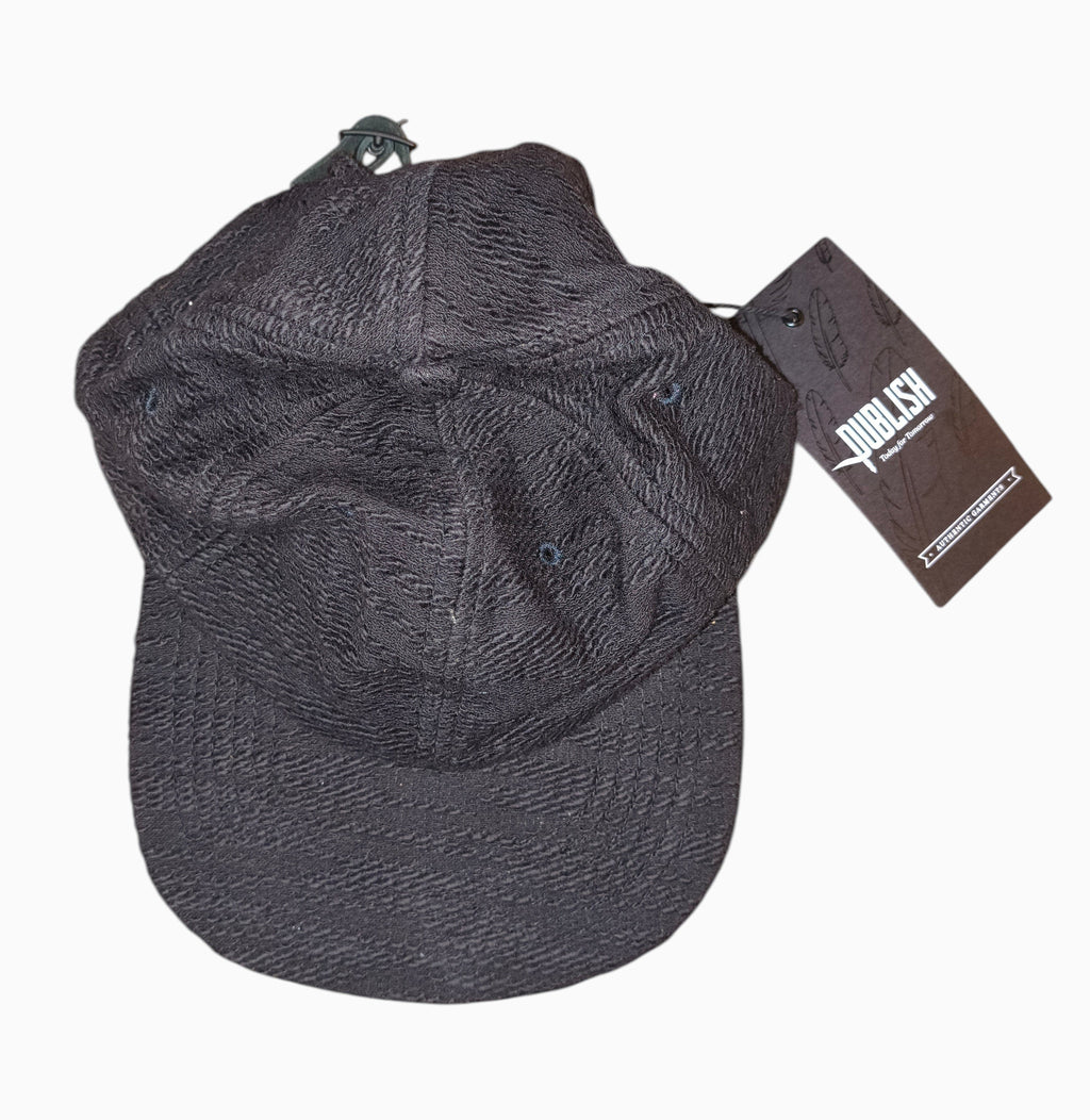 Awsum Thrift Publish Brand Davin black textured 5-panel camper hat with adjustable leather strapback and retail tag