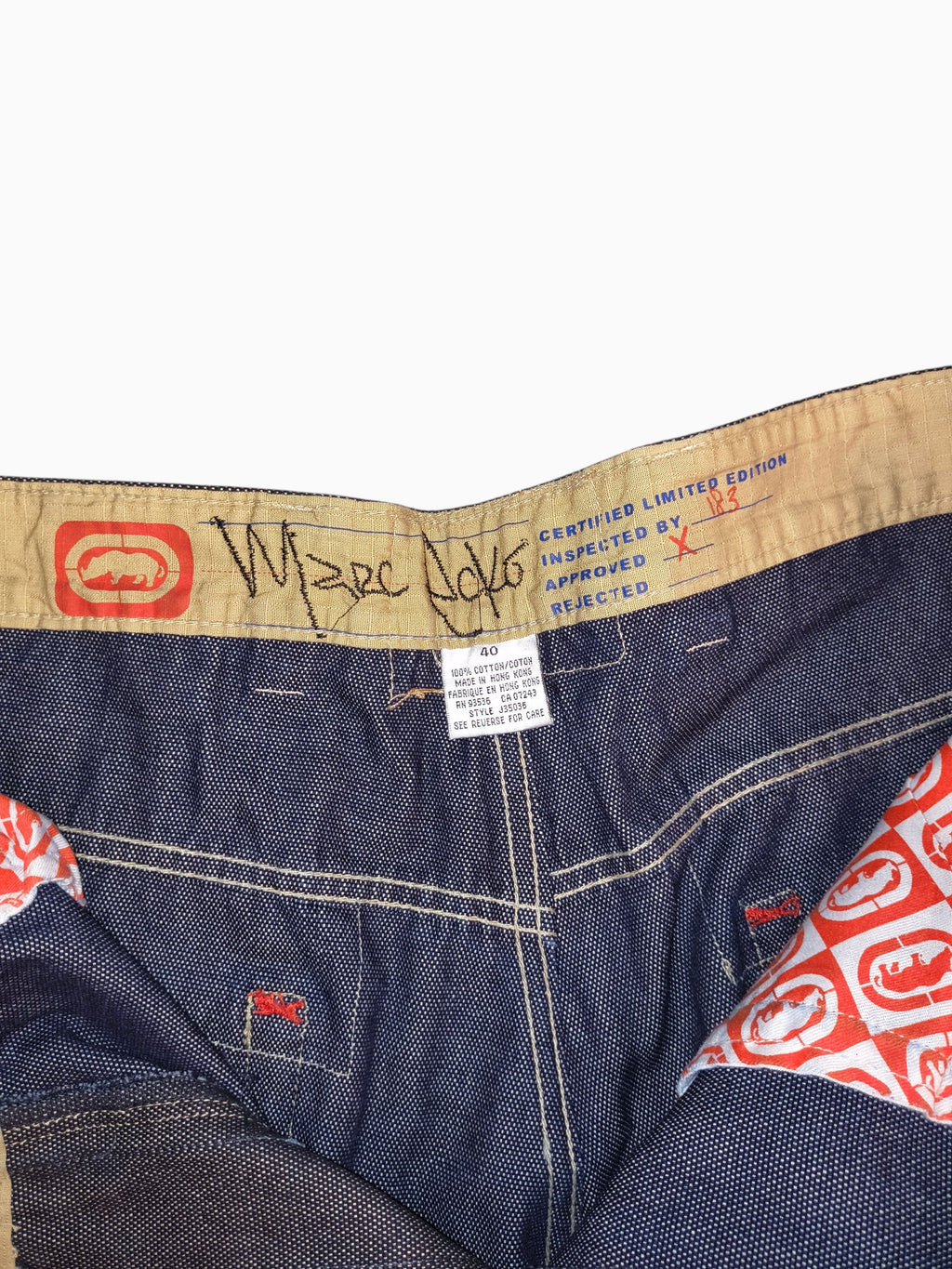 Awsum Thrift Marc Ecko limited edition jeans interior waist label with rhino logo and size 40 tag on dark denim