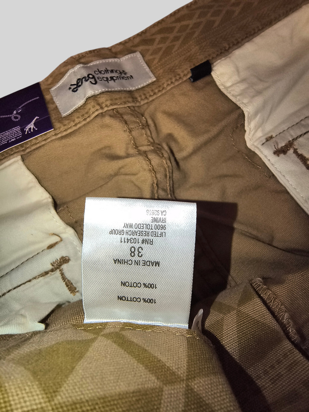 Awsum Thrift LRG khaki tan cotton cargo pants interior label showing size 38 and 100% cotton material composition
