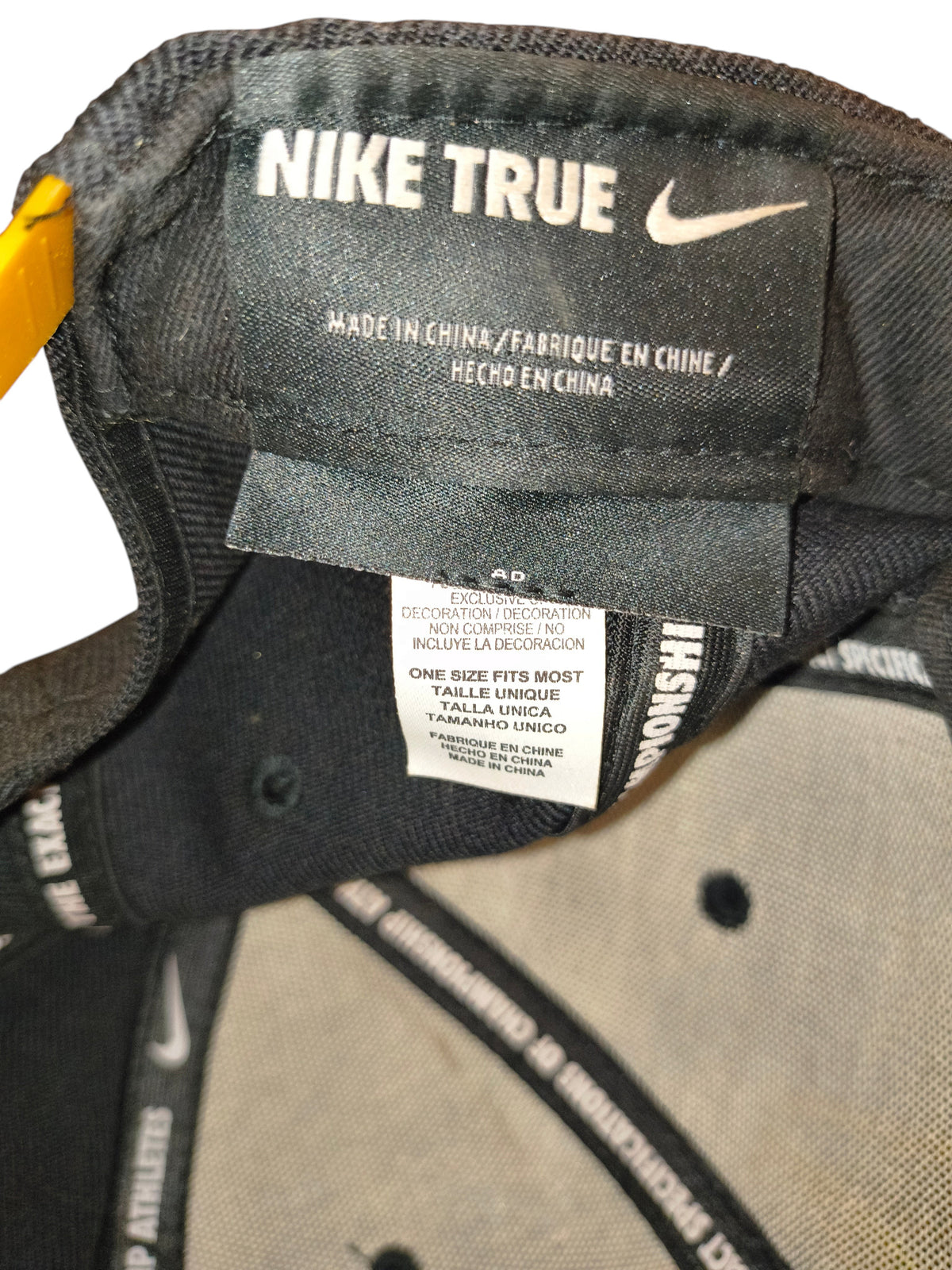 Awsum Thrift vintage Nike True snapback hat interior label showing size and manufacturing details